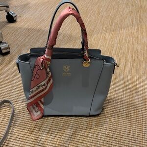 Blue Handbag with Pink Scarf Accent